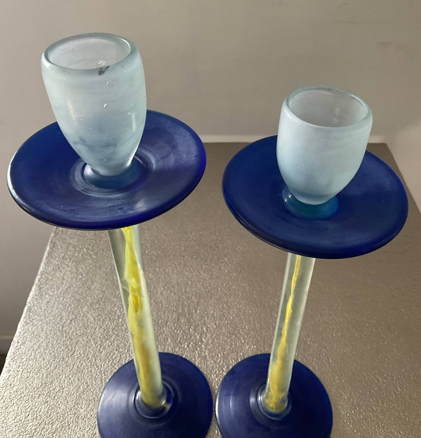 Duo of vintage Kosta Boda candlesticks in glass paste