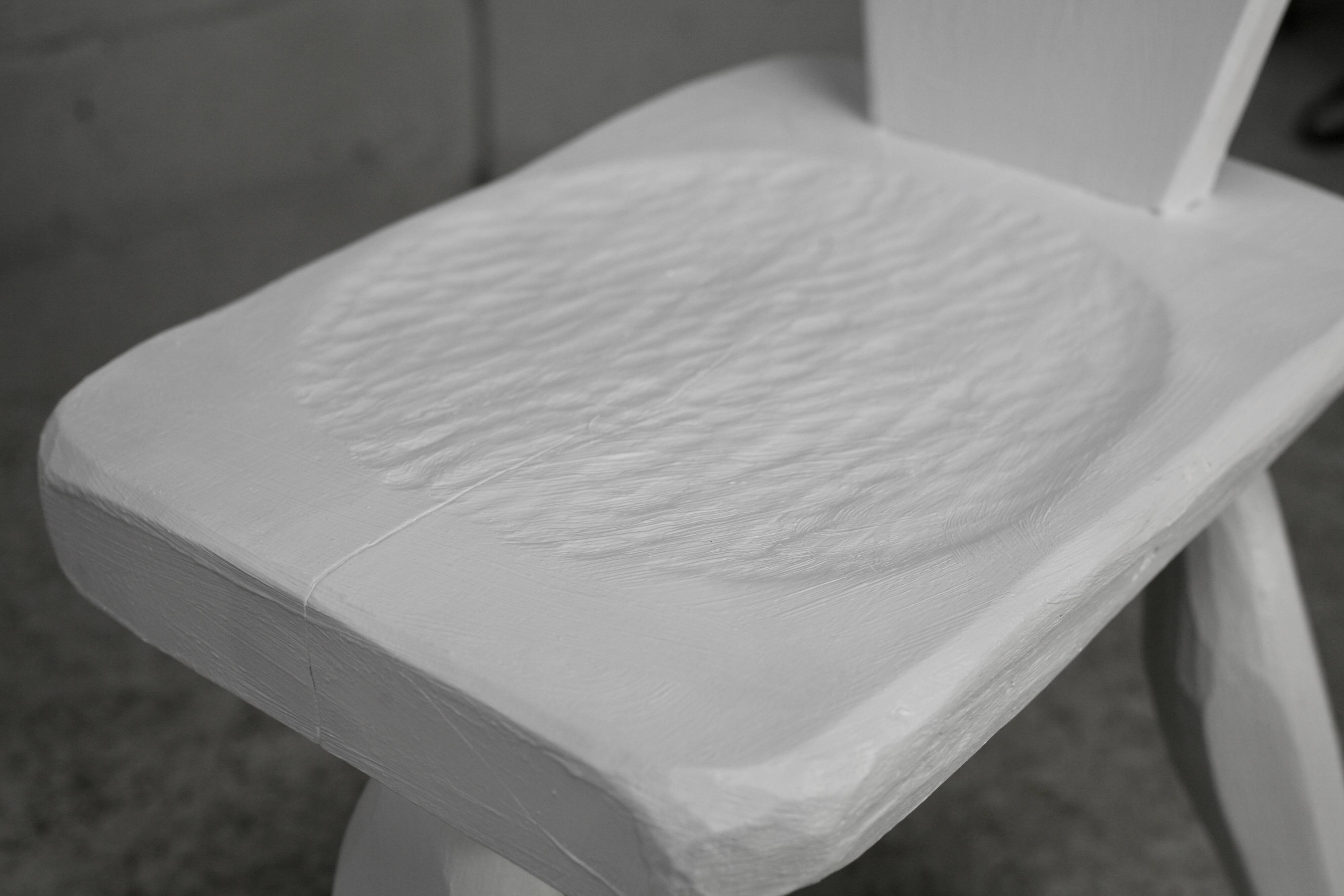 Pair of tripod chairs, gouged seats. Brutalist, circa 1960. Painted wood.