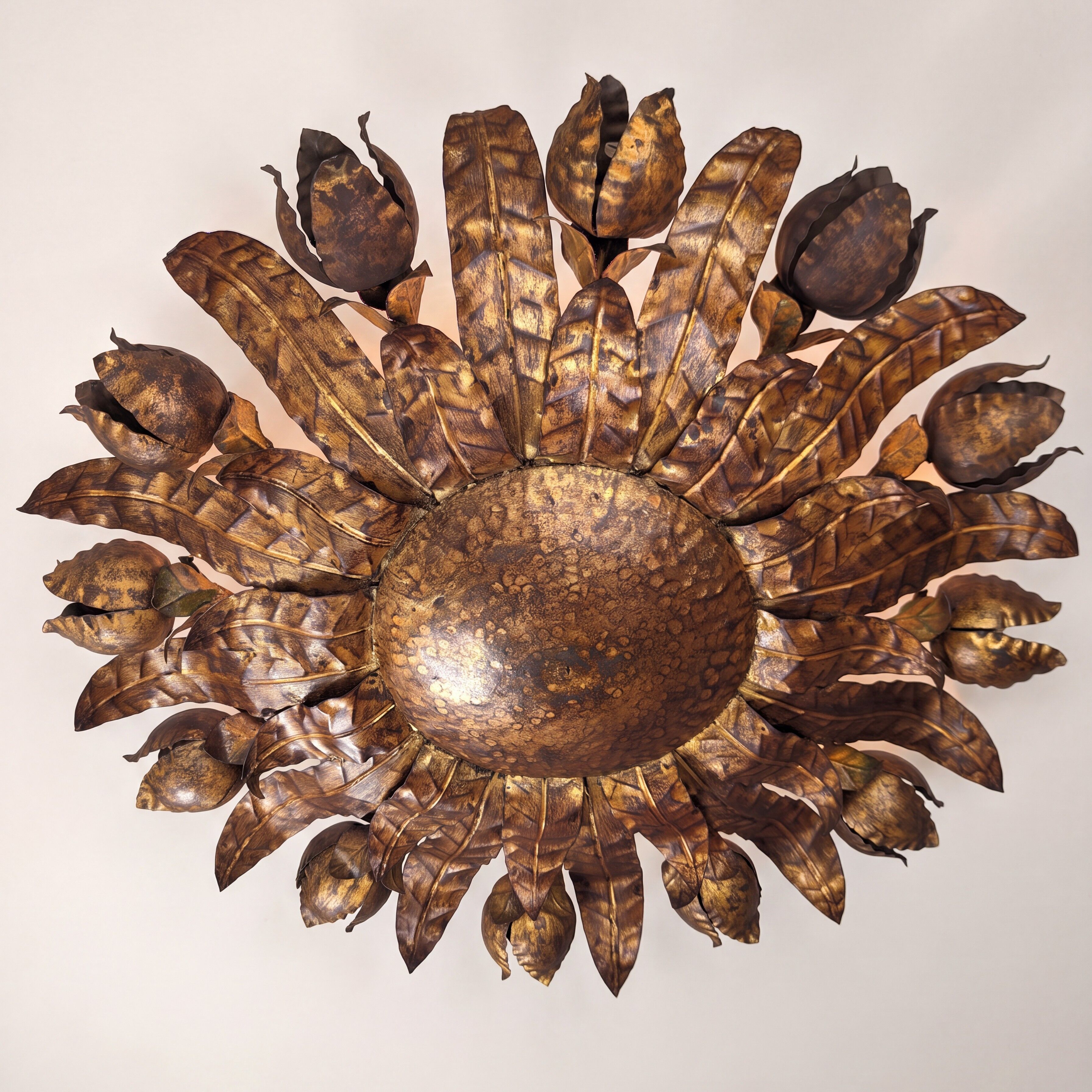Large mid-century sunburst ceiling lamp, gilded metal with floral motif, 1950s