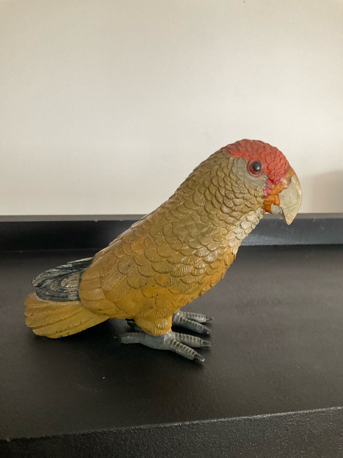 Vintage enamelled metal parakeet paperpress