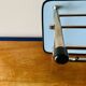 Vintage wall-mounted coat rack in wood and chrome metal with mirror