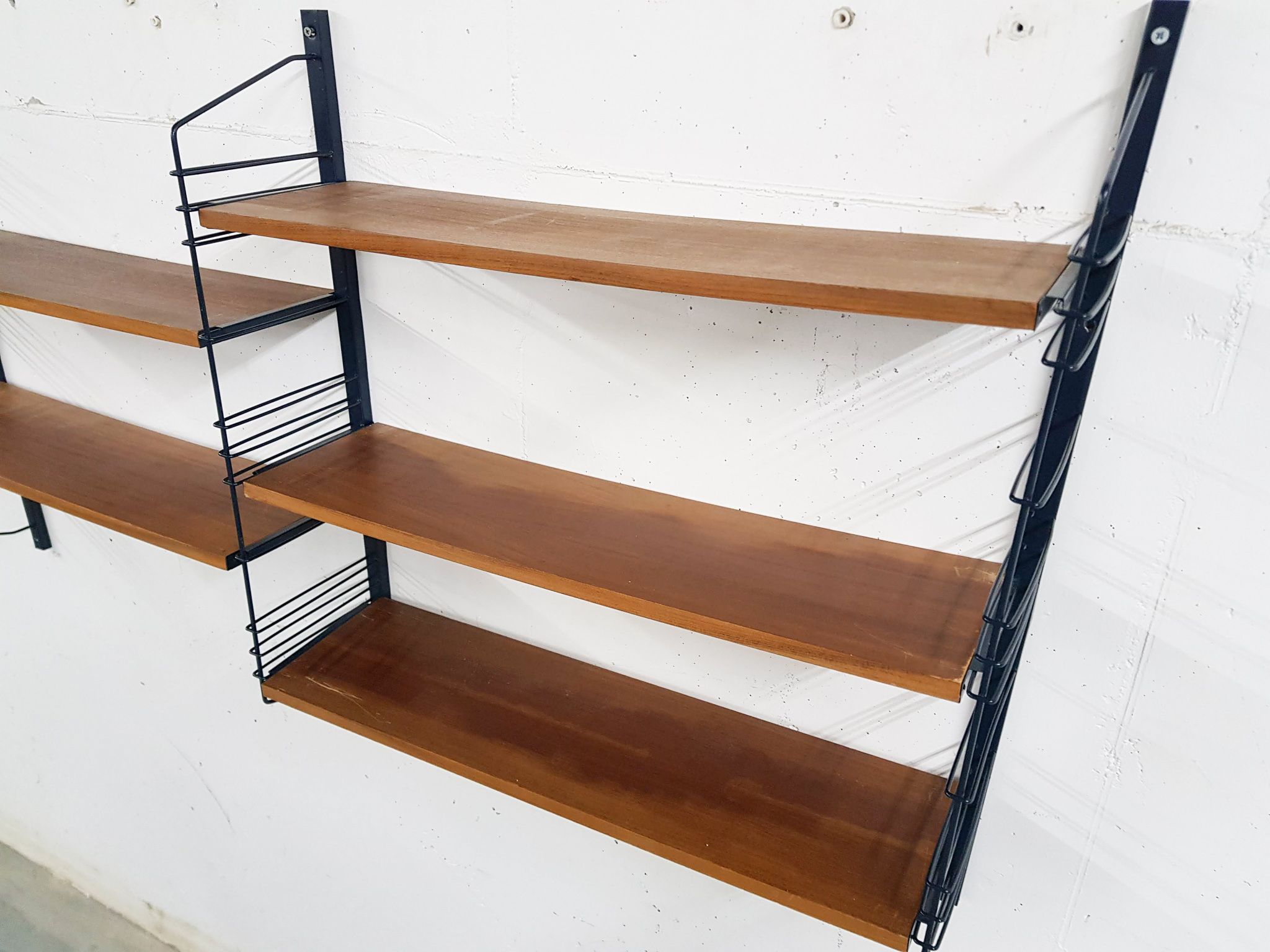 Mid-century book shelves in the style of Tomado
