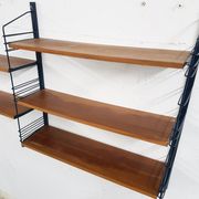 Mid-century book shelves in the style of Tomado