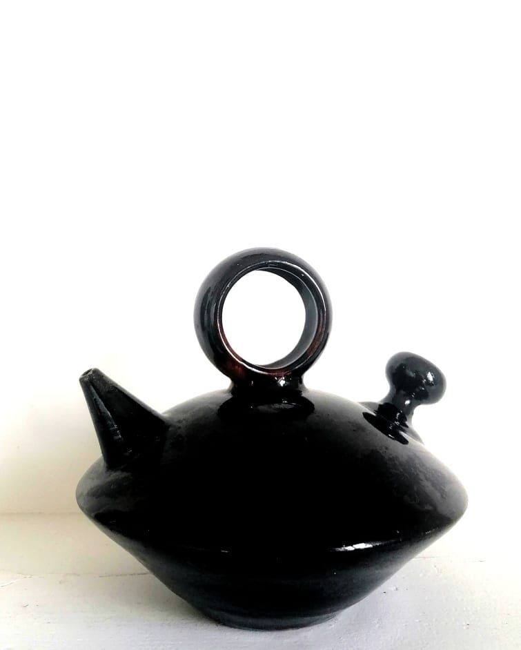 Chevrette modernist in black enamelled sandstone, circa 1970