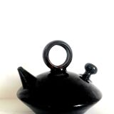 Chevrette modernist in black enamelled sandstone, circa 1970