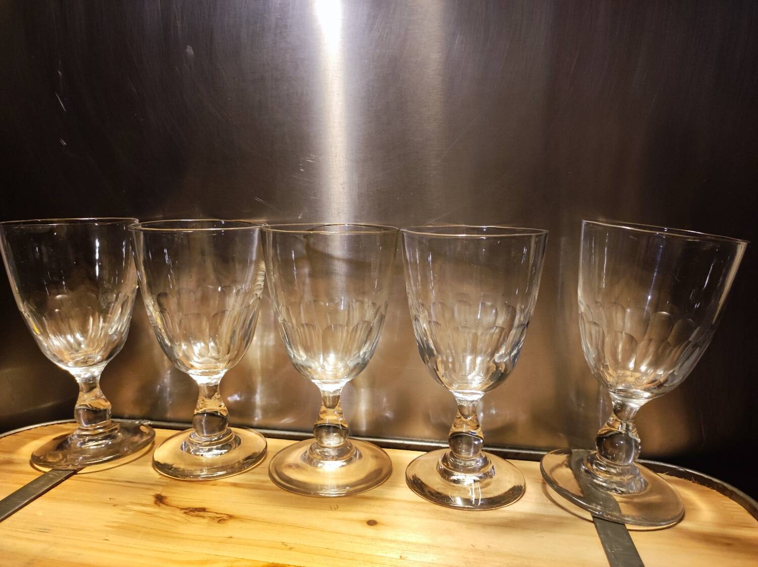 5 antique wine glasses with cut sides