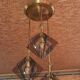 Suspension design in brass and smoked glass