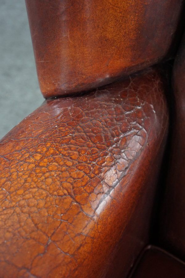 Patinated sheepskin armchair