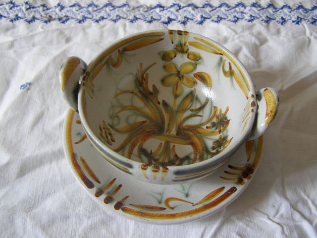Old bowl and its ceramic saucer from Quimper