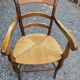 Cherry wood straw armchair