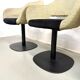 Series of six swivel chairs with an organic shell, patterned fabric and base.