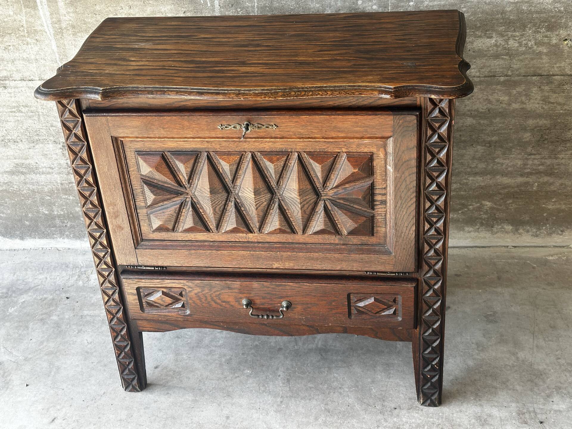 Small storage cabinet in carved oak – circa 1930