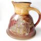 Orange enamelled stoneware pitcher signed La B for La Borne