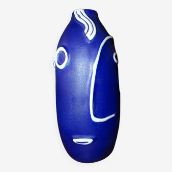 Ceramic vase with stylized face decoration