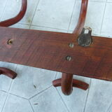 Coat rack with four double curved wooden pads