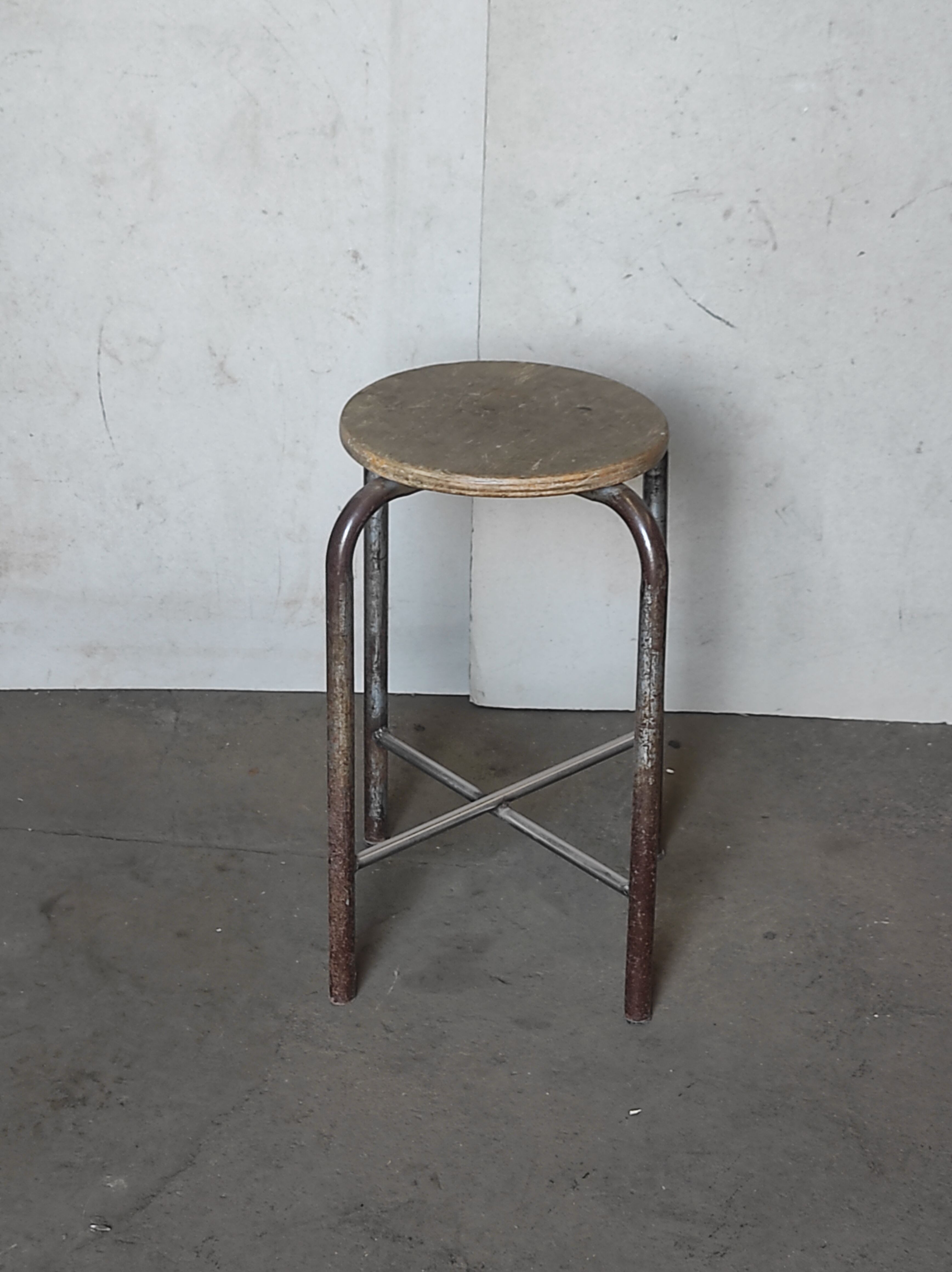 Old vintage metal and wood industrial workshop stool