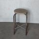 Old vintage metal and wood industrial workshop stool