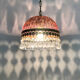 Vintage rose pendant light with pendants and patterned glass globe.