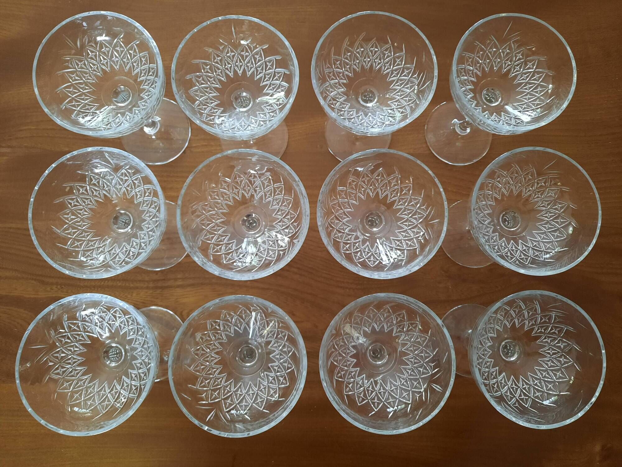 Set of 12 cut glass champagne glasses monogrammed EB.