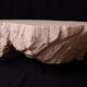 Designer coffee table with travertine rock effect — unique handcrafted piece.