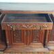 Art Nouveau buffet in carved oak with grapevine cluster decoration.