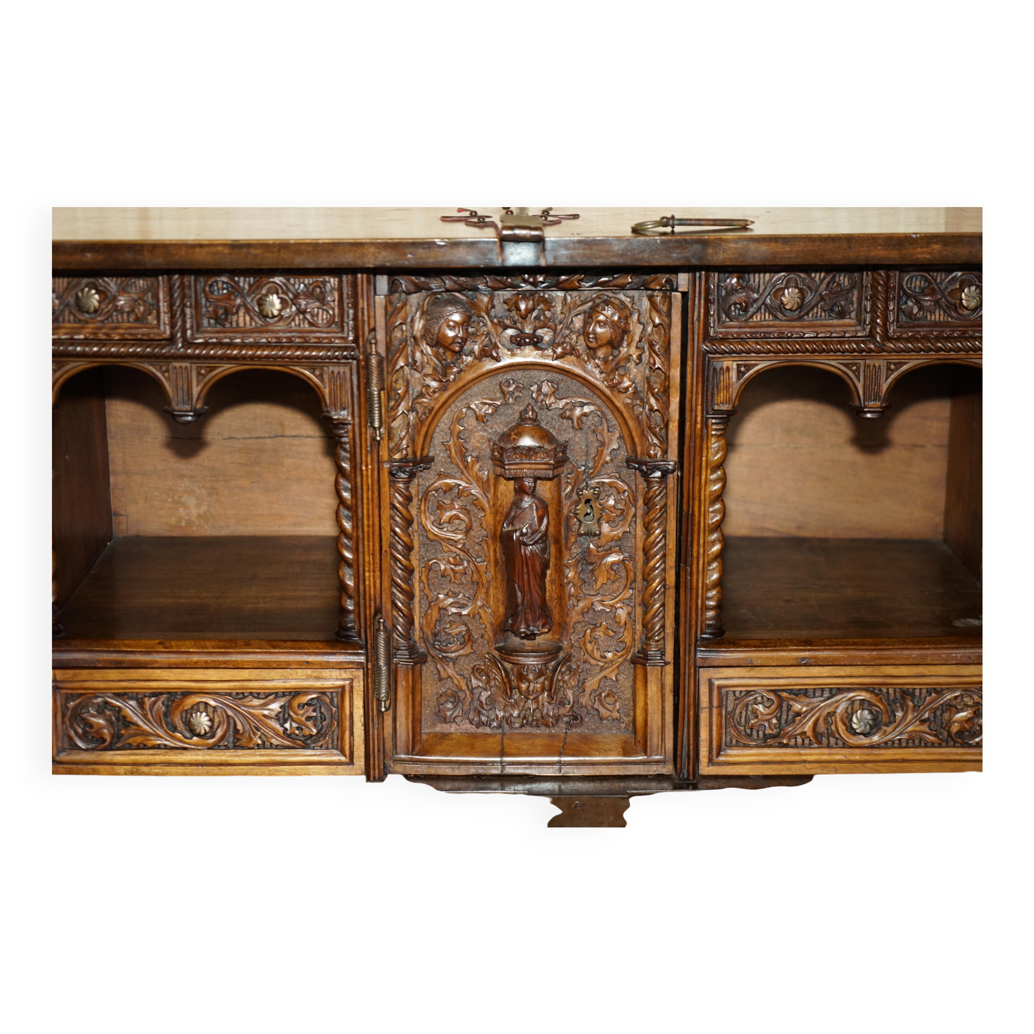 18th-century carved Spanish cabinet with hidden storage.