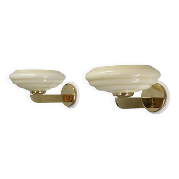 Pair of Czechoslovak Art Deco wall sconces from the 1940s in brass with opaline glass shades.