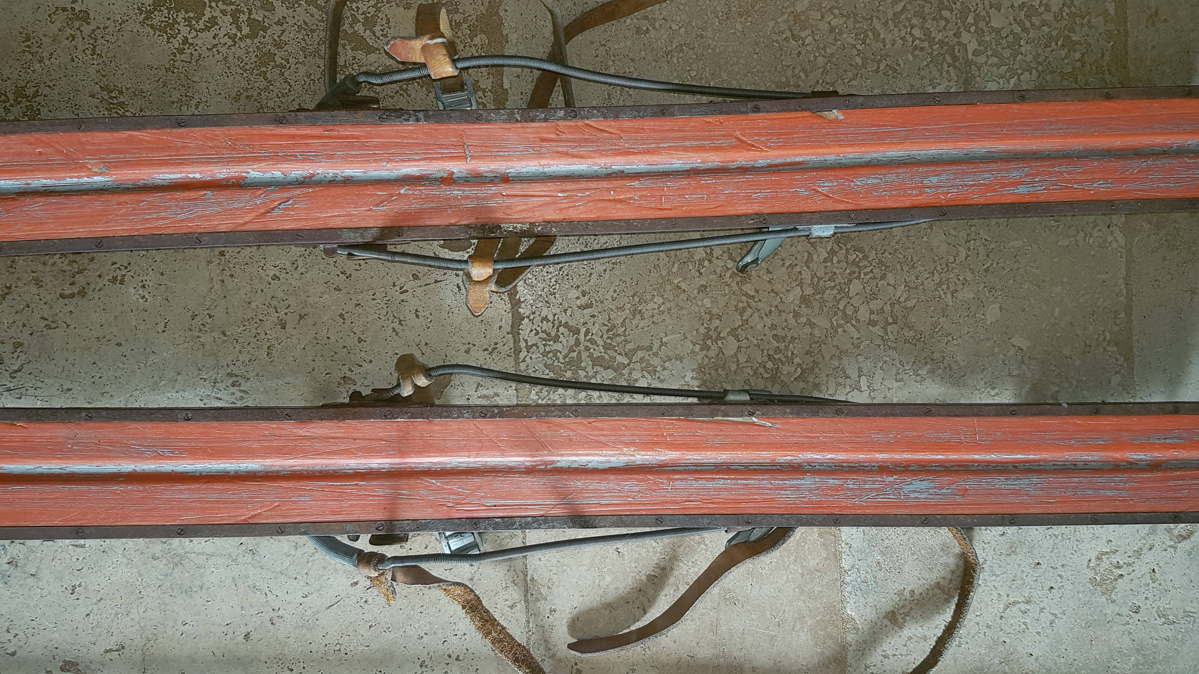 Old skis wooden and its pair of sticks