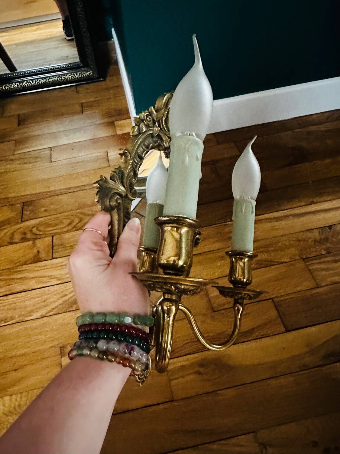 Antique bronze mirror wall sconce