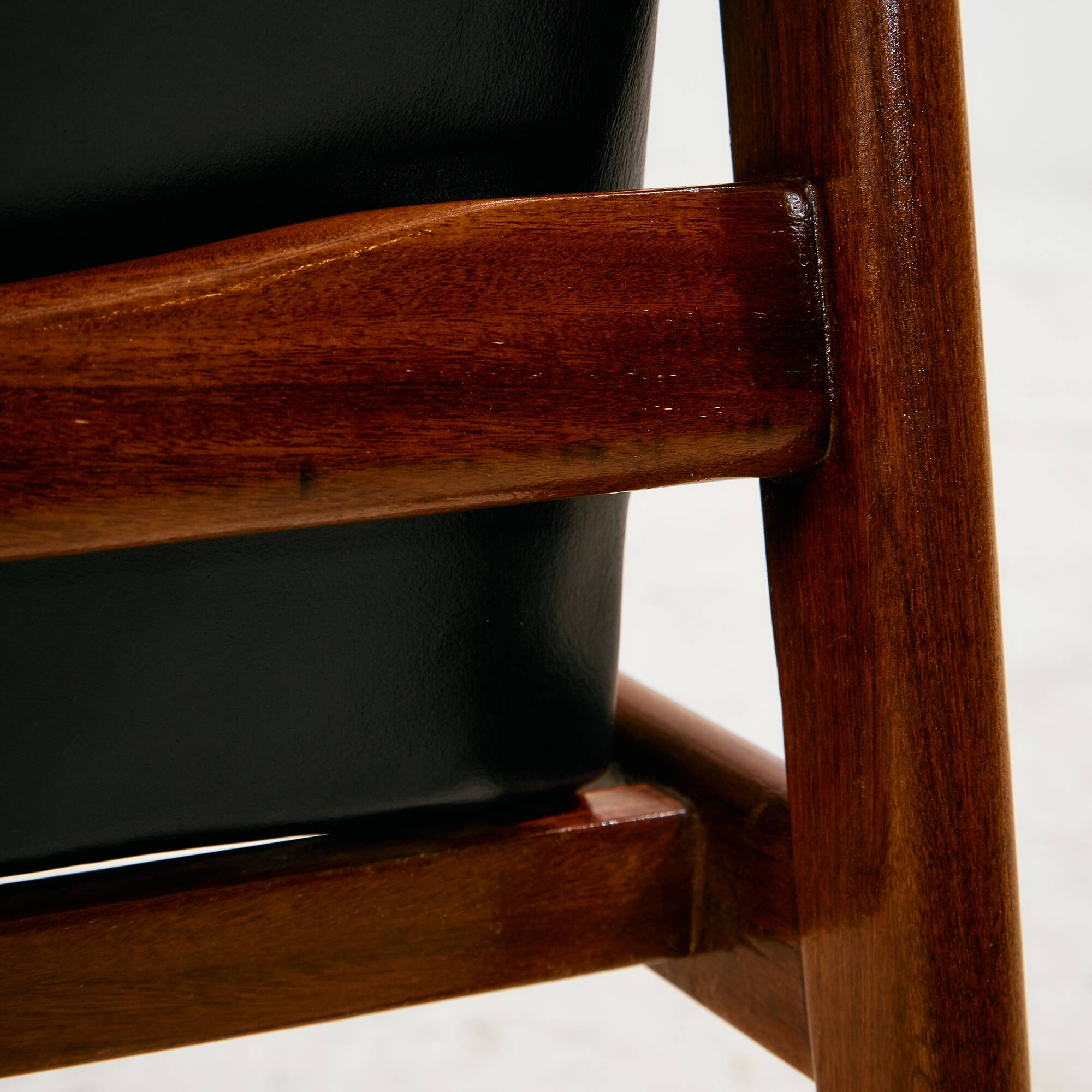 Teak armchair with leather upholstery