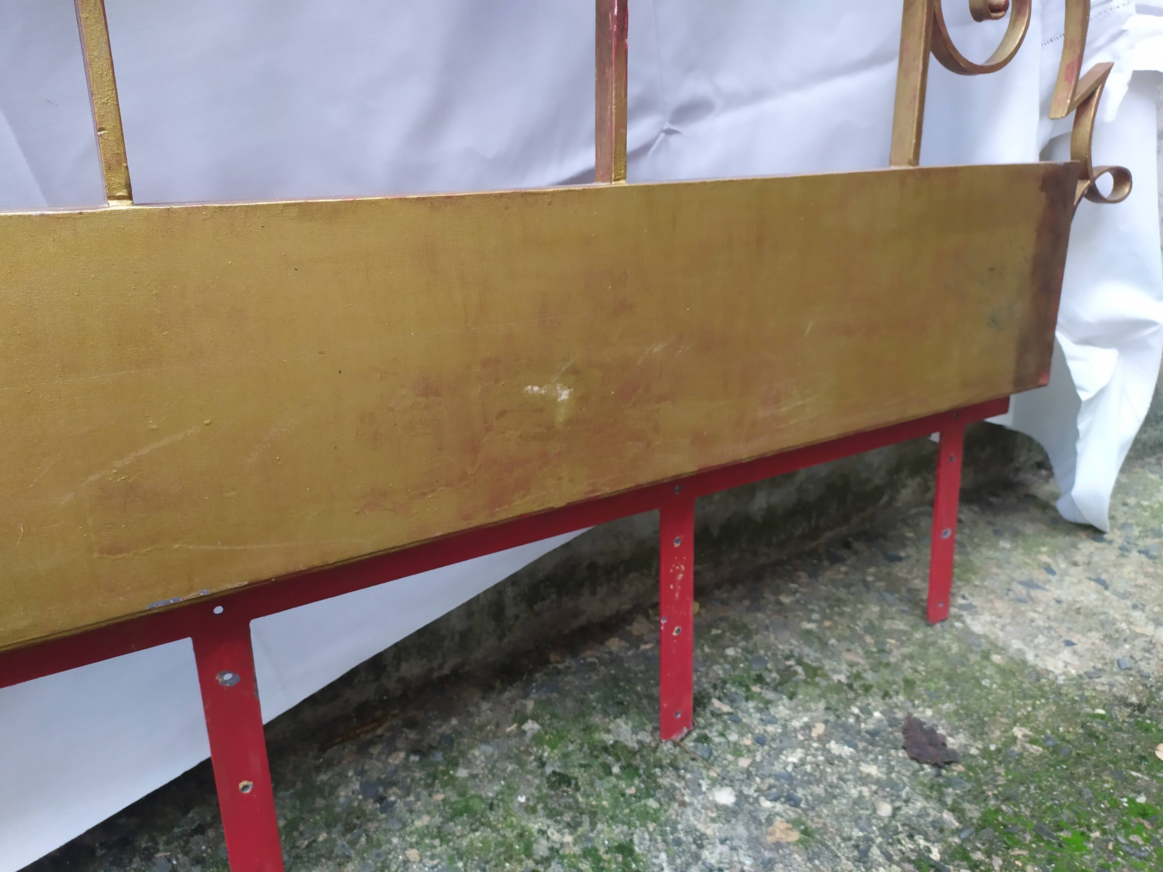 Golden wrought iron bedhead