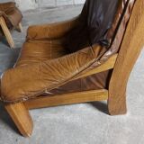 Armchairs in leather and vintage wood 70's