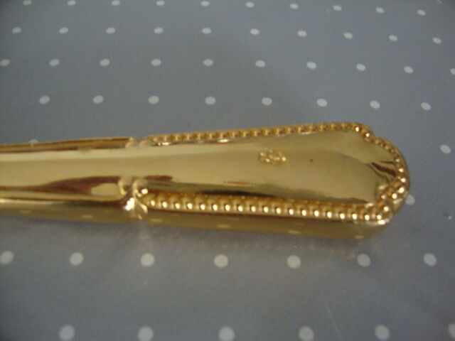 Golden metal pie shovel