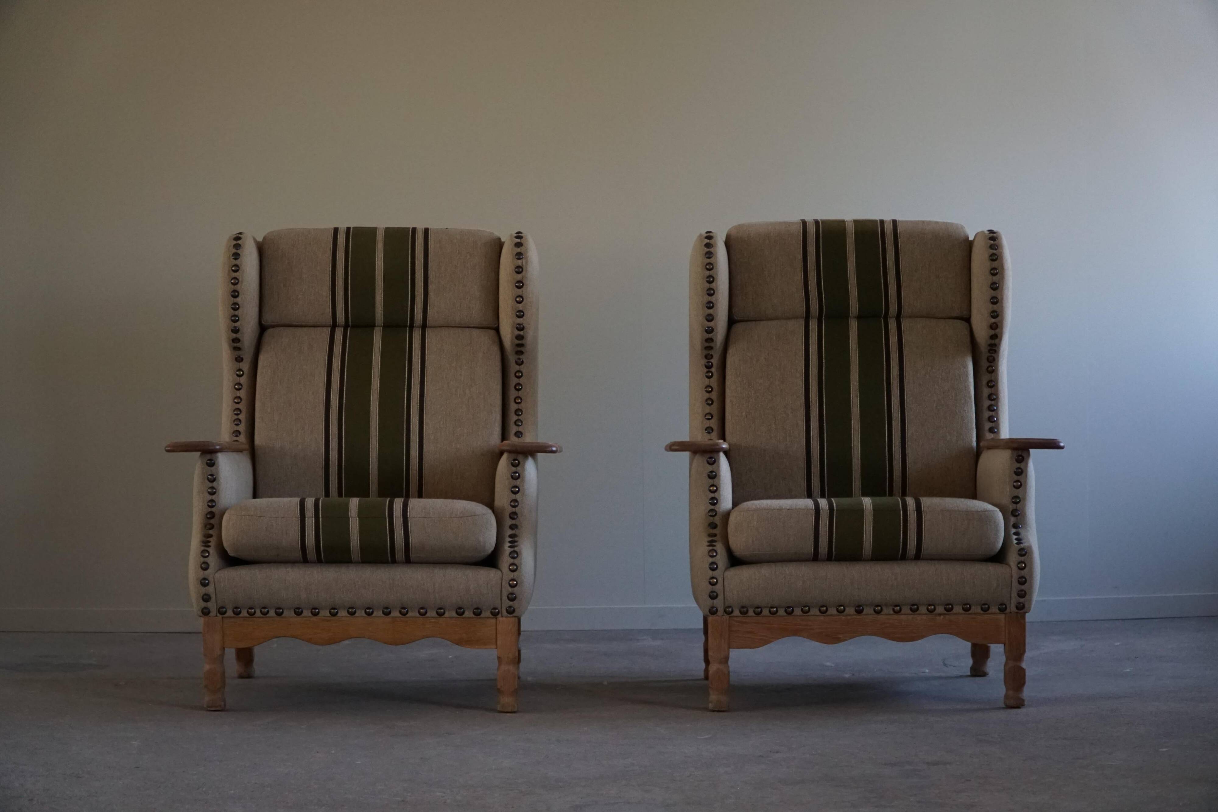 Pair of high-back lounge chairs in modern Danish style in the manner of Henning Kjærnulf, 1960s.