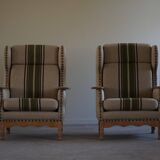 Pair of high-back lounge chairs in modern Danish style in the manner of Henning Kjærnulf, 1960s.