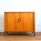 Storage cabinet with sliding curtain shutter 1950s