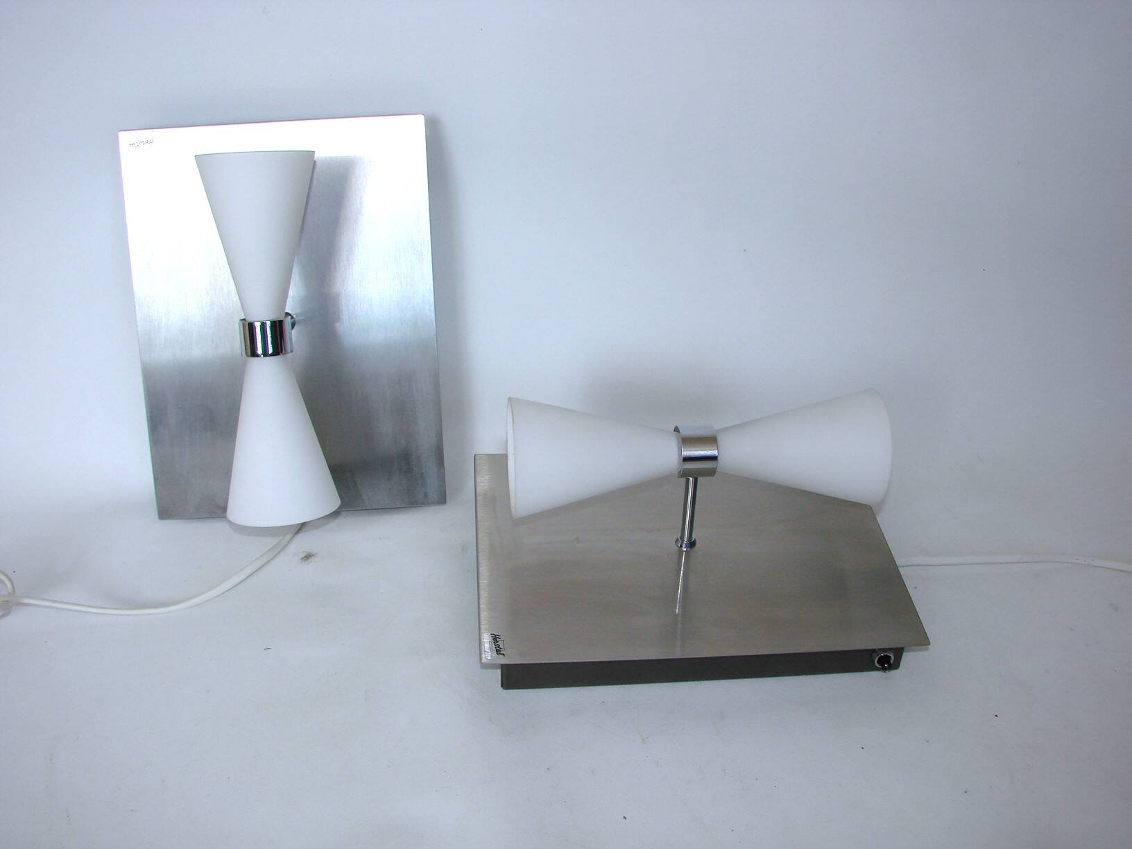 A pair of modern herstal wall lamps from the 2000s - stylish lighting for m