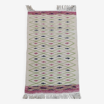 Handmade geometric patterned rug in natural wool
