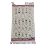 Handmade geometric patterned rug in natural wool