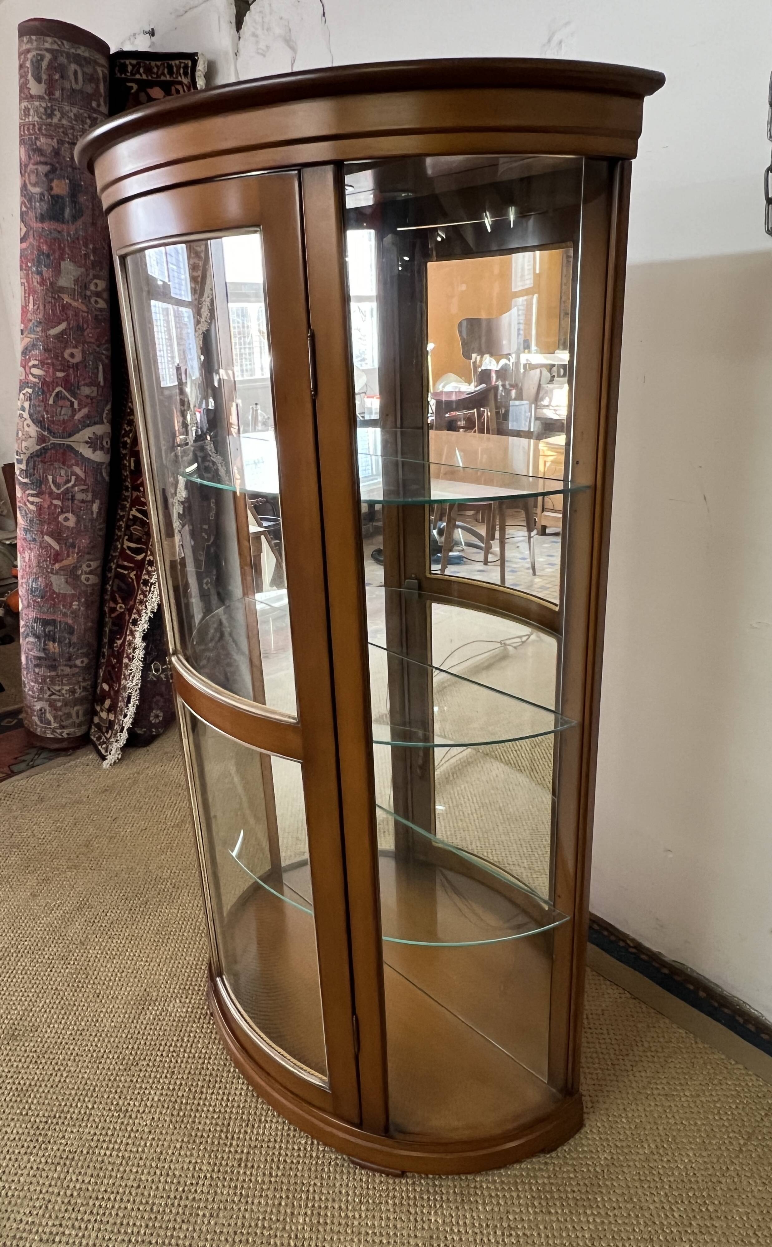 Wooden display case and half-moon mirror