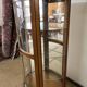 Wooden display case and half-moon mirror