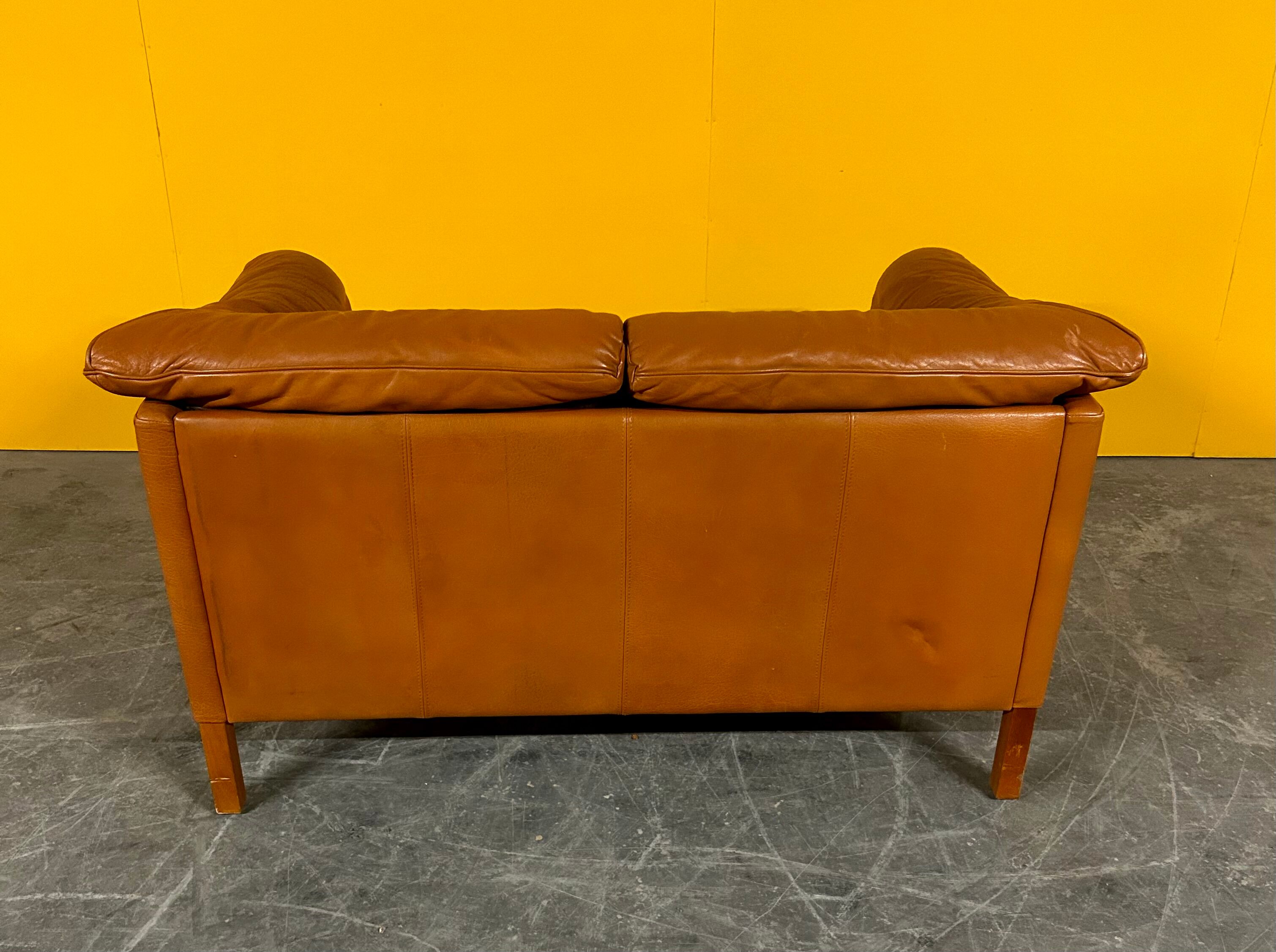 Danish two seater tan leather Stouby sofa