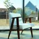 Scandinavian boucle armchair in snow white with dark walnut wood colour, designed by Chierowski, model 366.