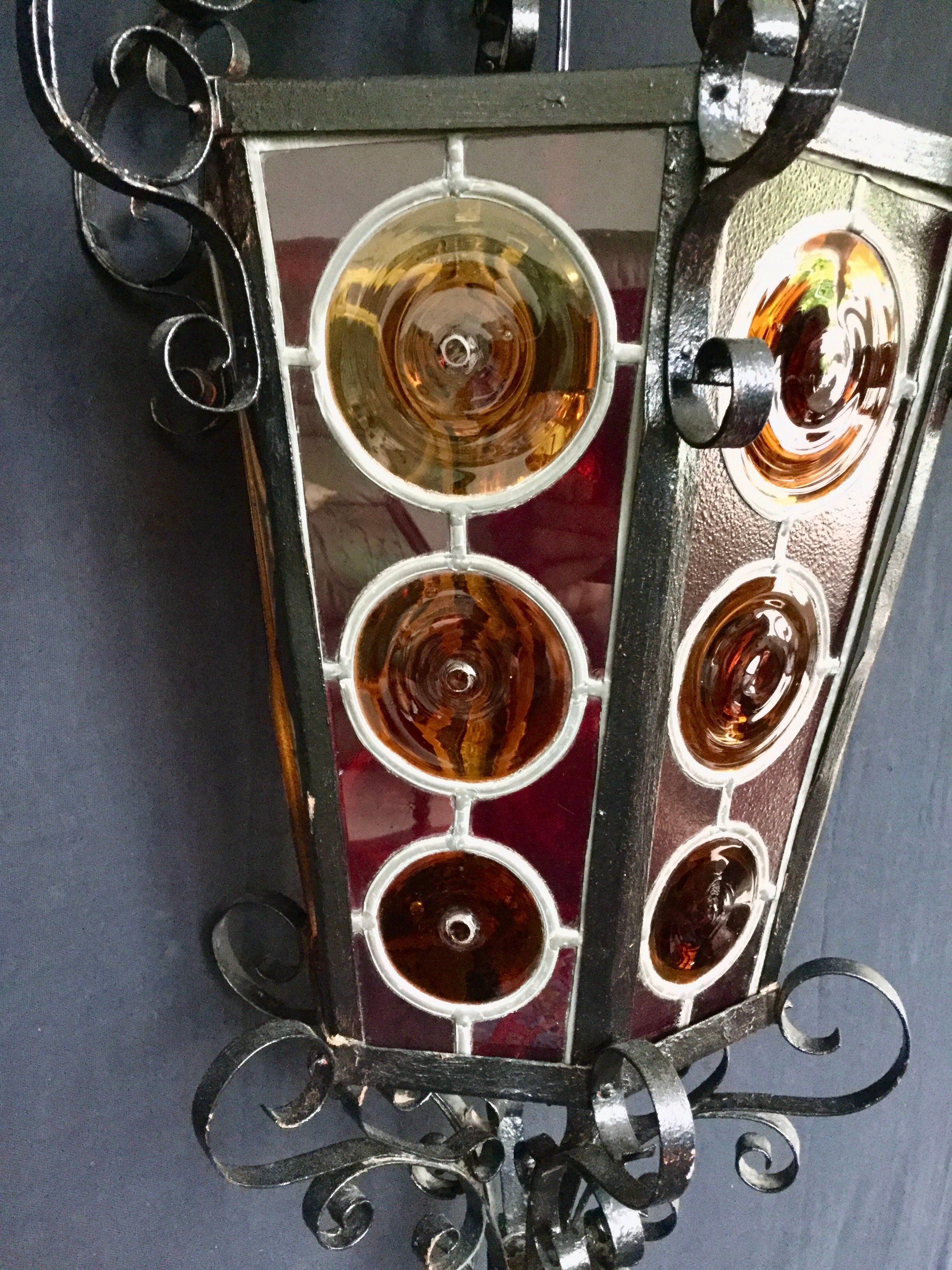 Wrought iron lantern and stained glass windows