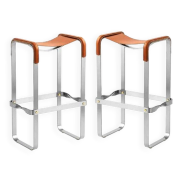 Pair of backless stools in tobacco colour with metal finishes.