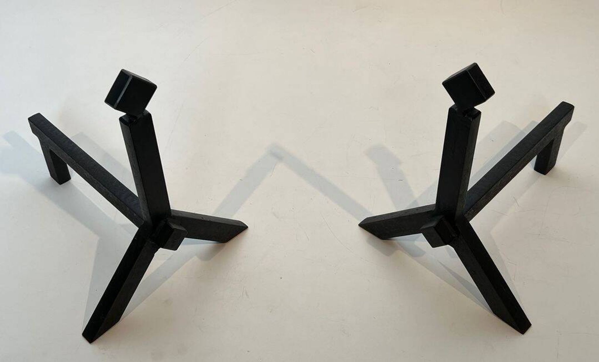 Pair of Modernist Black Iron Andirons with Diamond Finials and Angled Bases