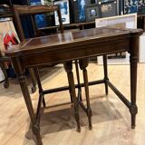 Classic nesting tables in wood and leather.