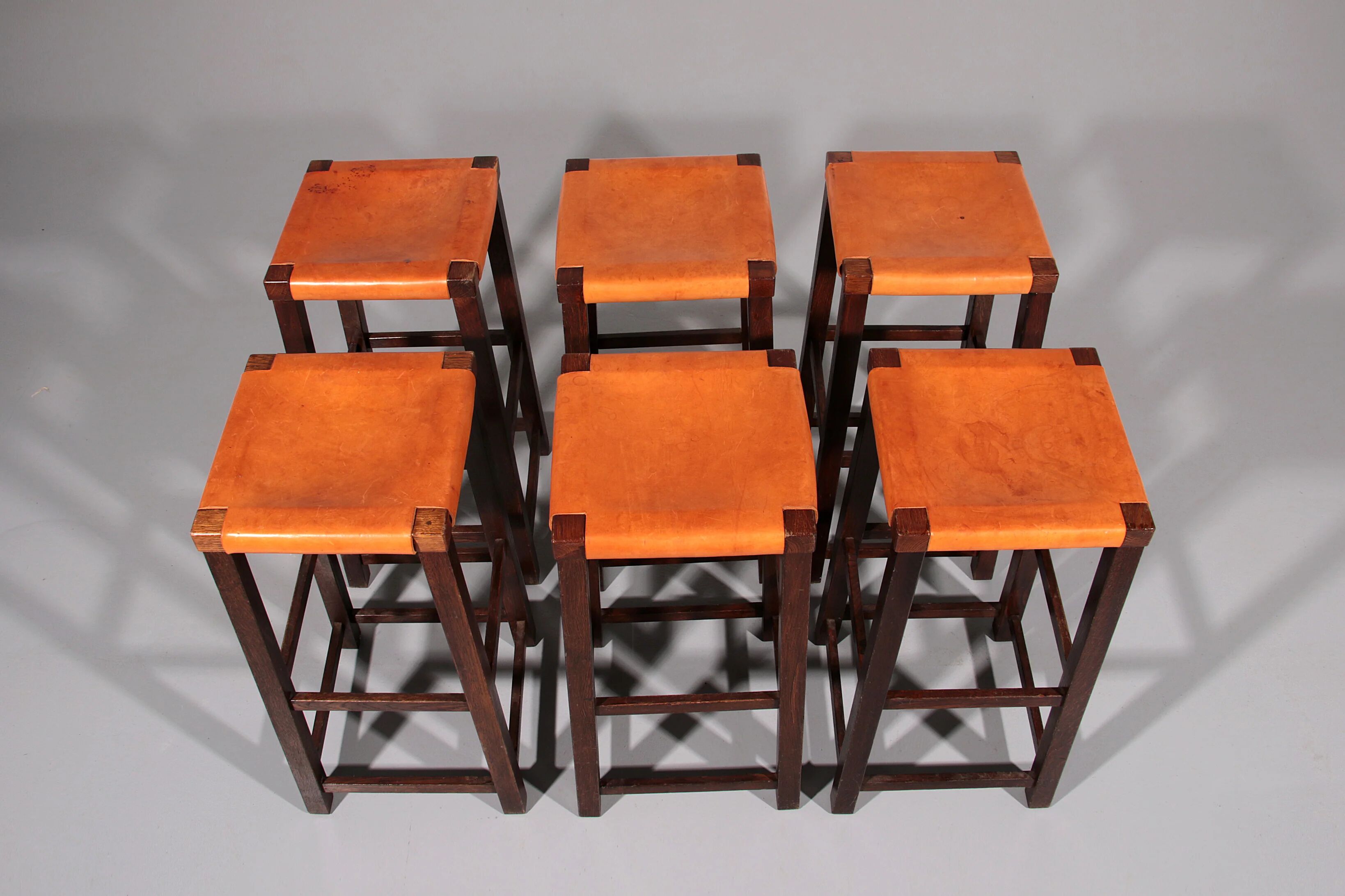 Mid-century oak bar stools with cognac leather seats