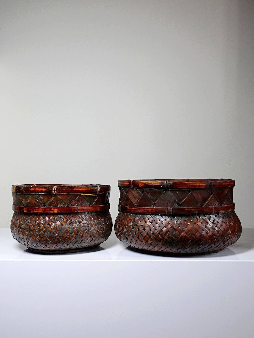 Pair of vintage nesting handmade Japanese woven bamboo baskets