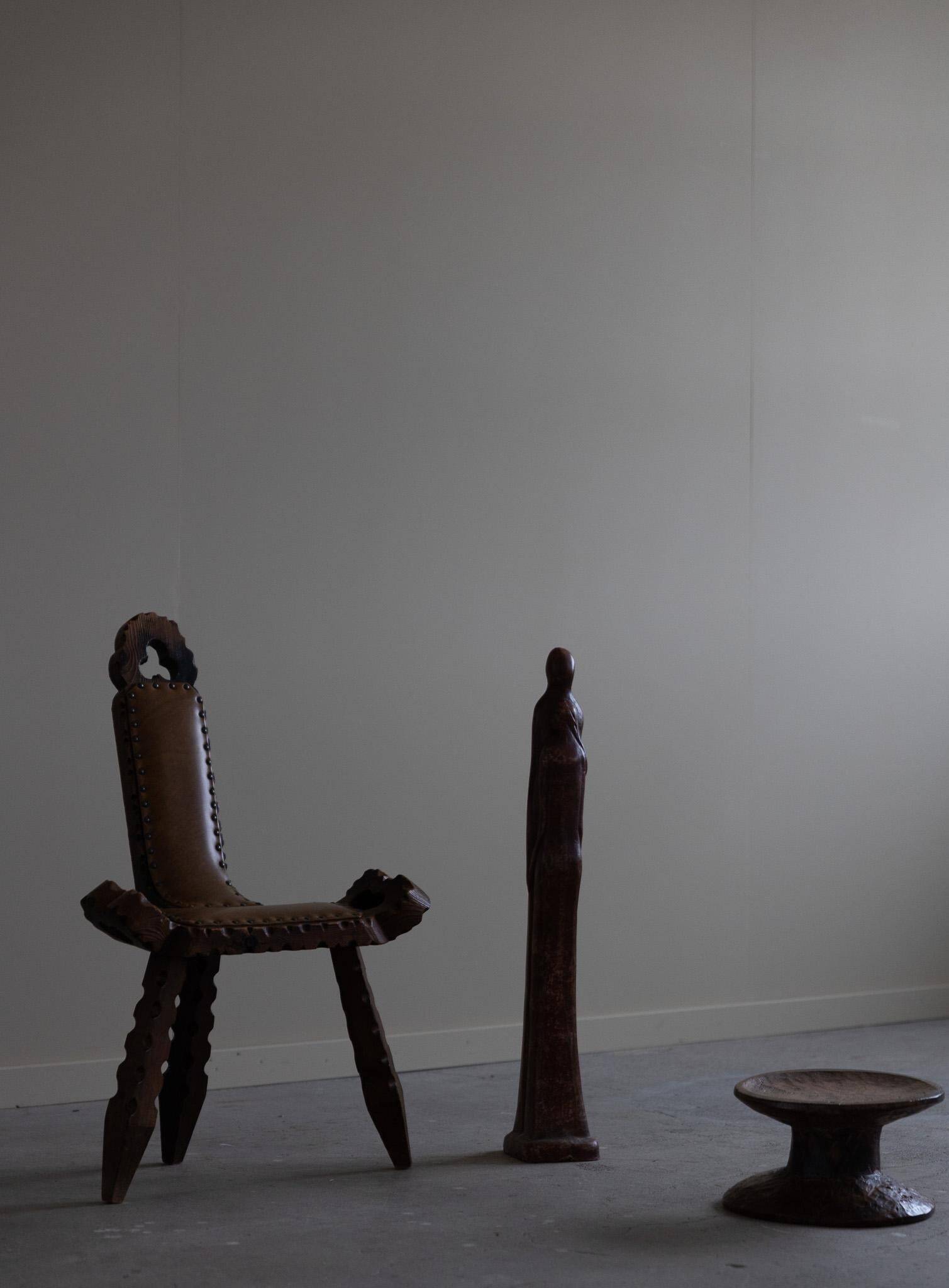 Carved wooden tripod chair with leather seat, Wabi Sabi, early 20th century.